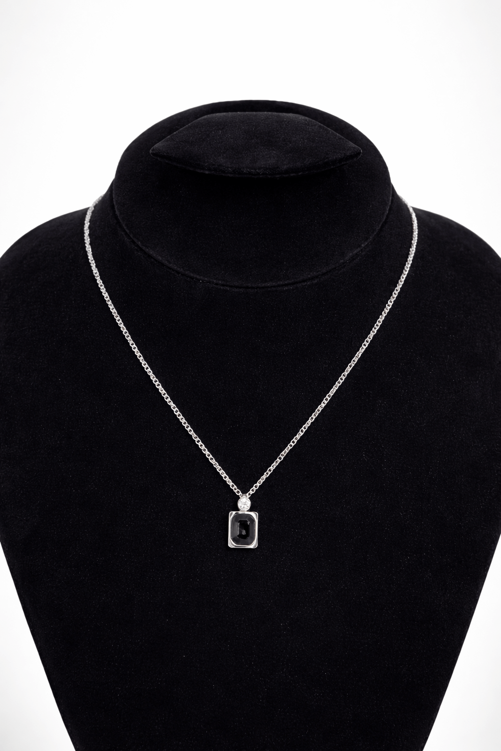 Black stone silver pendant necklace rectangular - Pakistani women's modern jewelry with rectangular black stone and silver tone frame front view