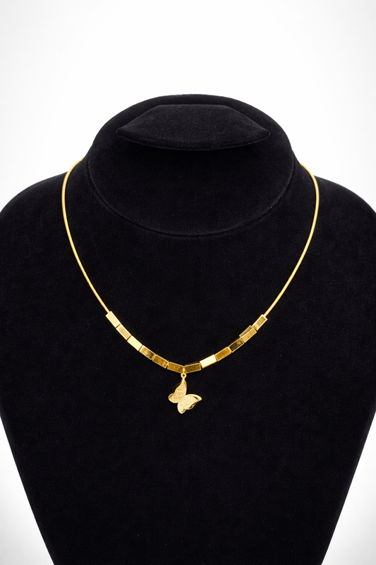 Golden butterfly bar necklace - Pakistani women's elegant jewelry with butterfly charm and geometric gold tone bar detailing front view