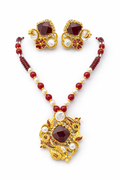 Ruby pearl royal necklace set - Pakistani women's luxury bridal jewelry with intricate gold tone craftsmanship and matching earrings front view