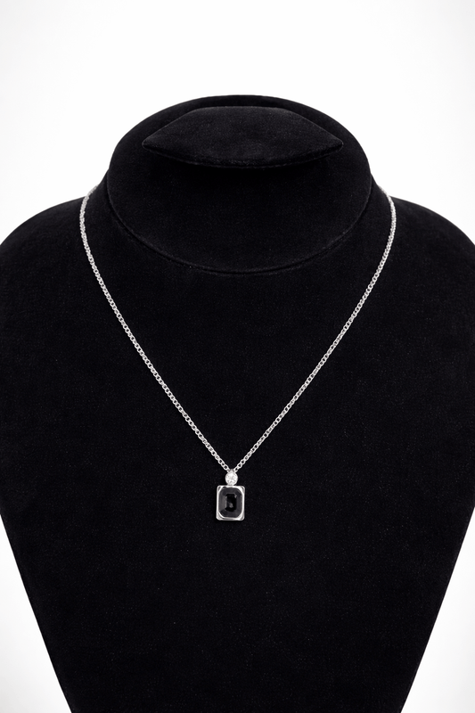 Black stone silver pendant necklace rectangular - Pakistani women's modern jewelry with rectangular black stone and silver tone frame front view